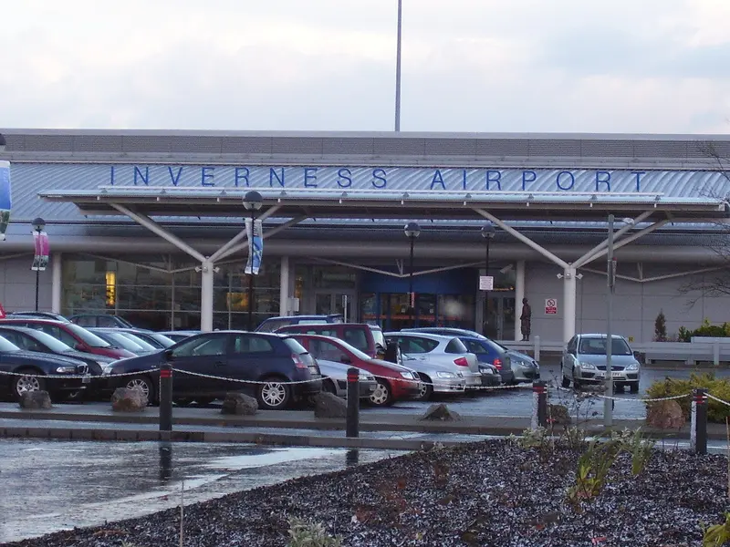 The terminal at Inverness Airport with its car park in front