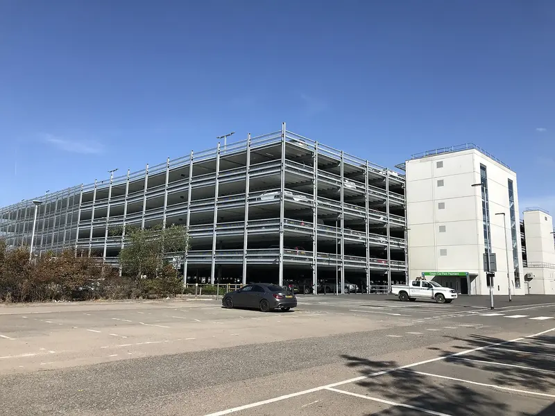 A new multi-storey car park at Stansted Airport under a blue sky